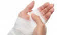 white medicine bandage on injury hand on white background